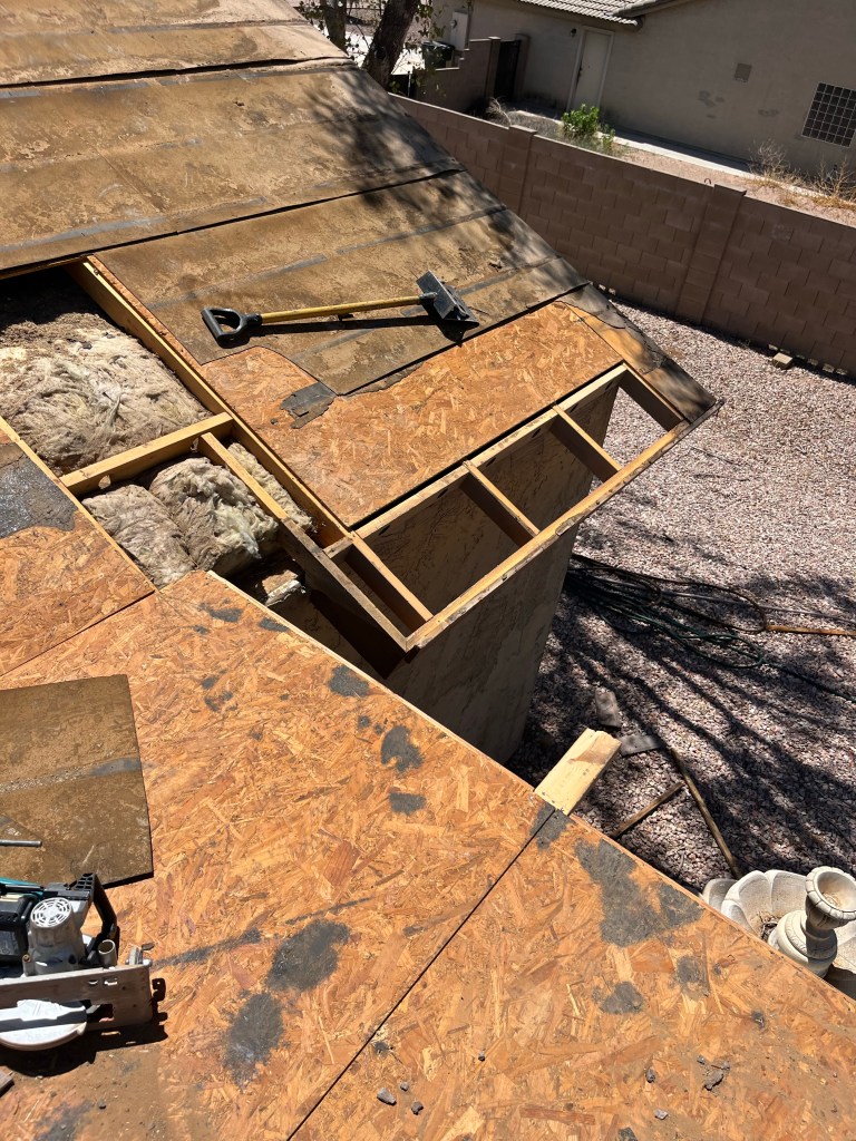 Wood decking removed in areas on tile roof